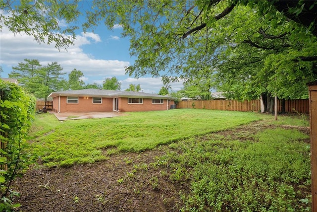 2417 NW 55th Ter, Oklahoma City, OK 73112 - view of yard featuring a fenced backyard and a patio
