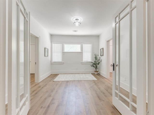 1132 NE 17th St, Oklahoma City, OK 73111 - interior space featuring baseboards, light wood finished floors, and visible vents