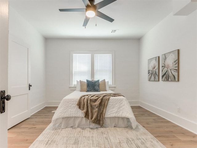 1132 NE 17th St, Oklahoma City, OK 73111 - bedroom featuring baseboards, a ceiling fan, and light wood-style flooring