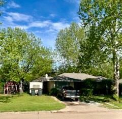 8 Burk Way, Del City, OK 73115 - view of front of house featuring driveway and a front yard