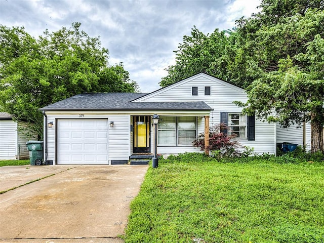 view of front of property with a shingled roof, an attached garage, concrete driveway, and a front lawn