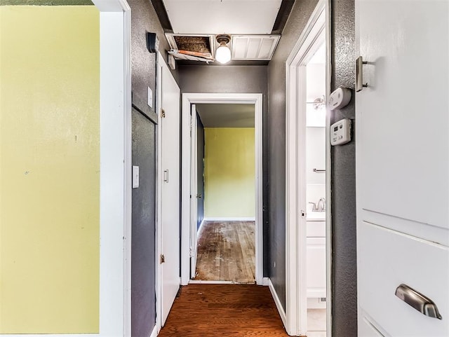 hall with dark wood-type flooring