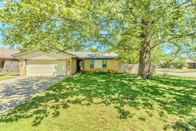 ranch-style house with fence, a front yard, brick siding, concrete driveway, and an attached garage