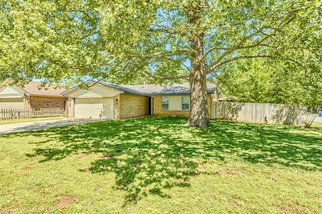 ranch-style home featuring driveway, a front yard, a garage, brick siding, and fence