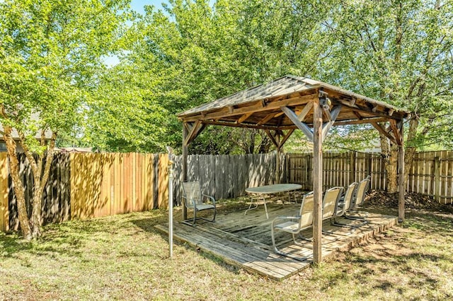 view of yard featuring a fenced backyard, a wooden deck, and a gazebo