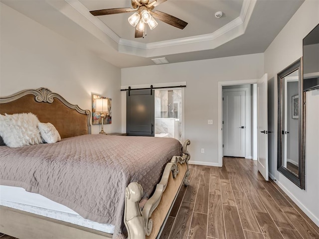 bedroom with crown molding, ceiling fan, a raised ceiling, baseboards, and wood finished floors