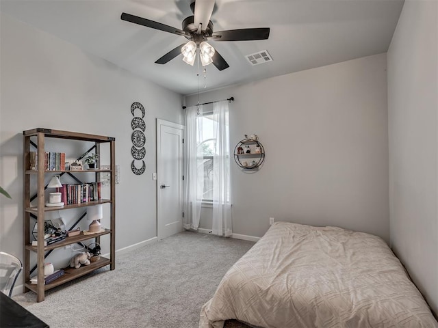 bedroom featuring carpet flooring, a ceiling fan, baseboards, and visible vents