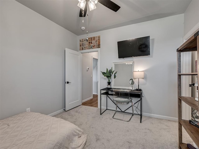 bedroom featuring baseboards, ceiling fan, and carpet