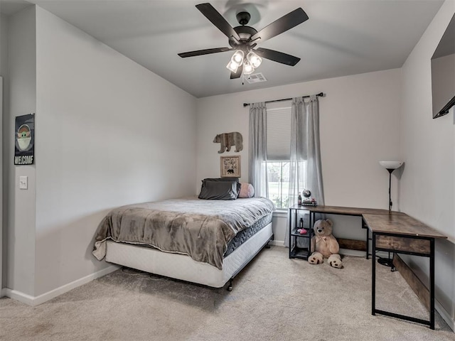 carpeted bedroom featuring visible vents, a ceiling fan, and baseboards