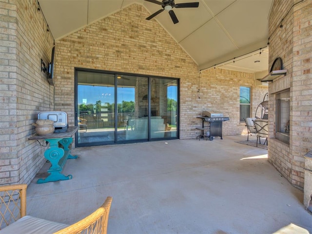 view of patio featuring a ceiling fan and a grill