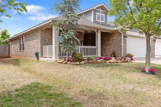 view of front of house with a porch, brick siding, and a front yard