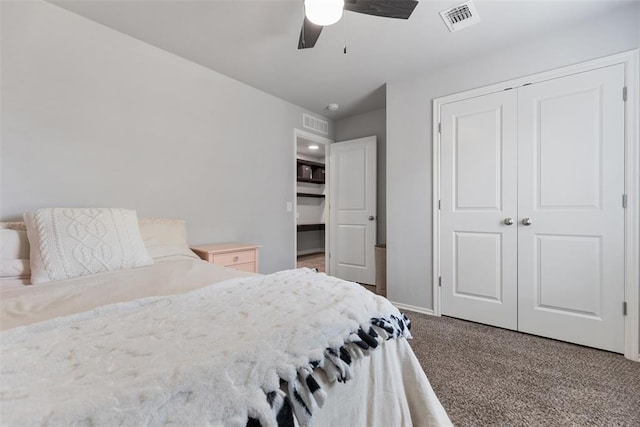 bedroom featuring visible vents, carpet flooring, a ceiling fan, and a closet