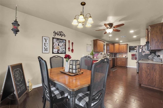 107 Chuckwagon Way, Elk City, OK 73644 - dining area featuring recessed lighting, ceiling fan with notable chandelier, dark wood-style floors, and visible vents