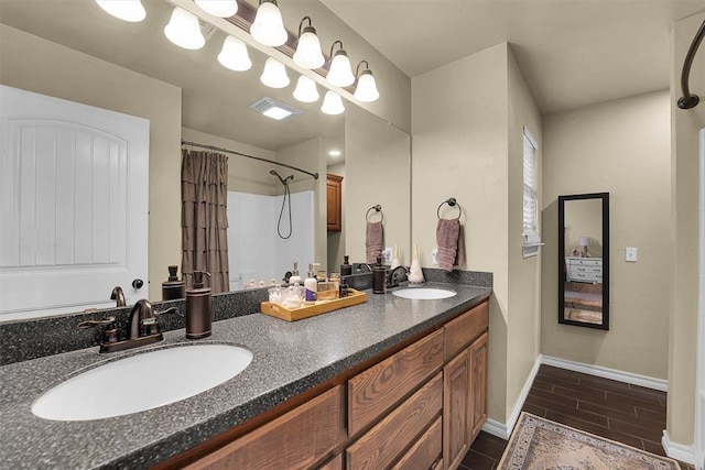 107 Chuckwagon Way, Elk City, OK 73644 - full bath with visible vents, a sink, baseboards, and double vanity