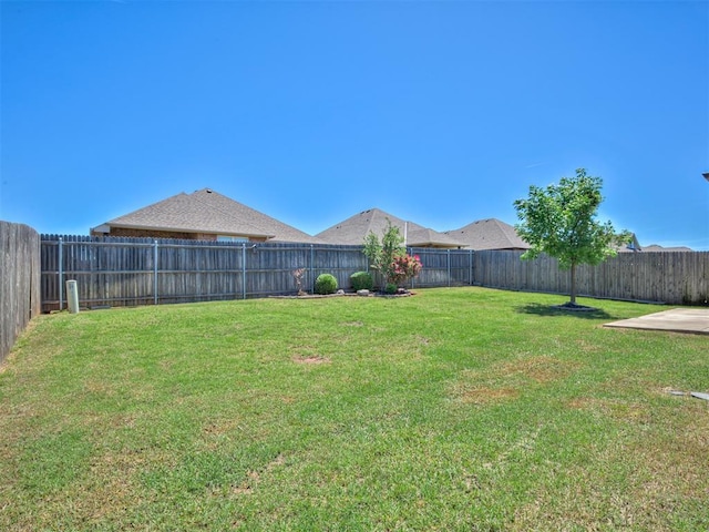 view of yard with a fenced backyard
