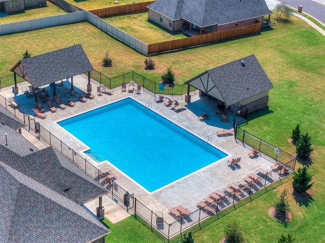 community pool featuring a gazebo, a lawn, fence, and a patio area