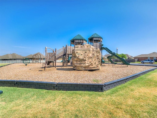 community jungle gym with a lawn