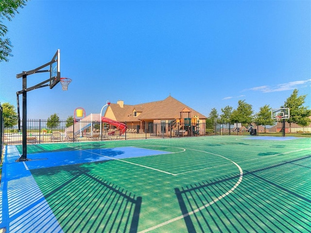 view of basketball court with fence and community basketball court