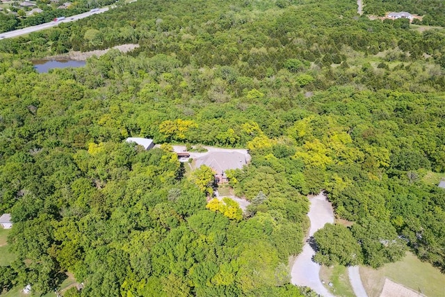 12700 Jabez Rd, Edmond, OK 73013 - aerial overview of property's location featuring a heavily wooded area and a nearby body of water
