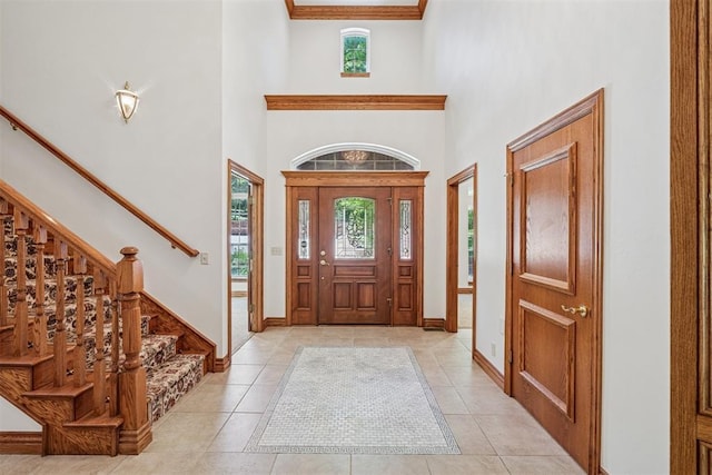 12700 Jabez Rd, Edmond, OK 73013 - entrance foyer with plenty of natural light, a high ceiling, stairs, and light tile patterned floors