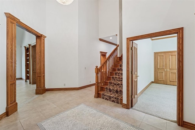 12700 Jabez Rd, Edmond, OK 73013 - stairway with a towering ceiling and tile patterned flooring