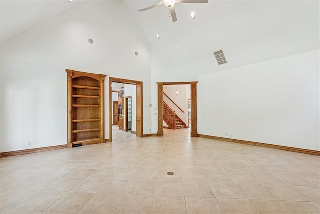 12700 Jabez Rd, Edmond, OK 73013 - unfurnished room with high vaulted ceiling, stairway, a ceiling fan, and light tile patterned floors