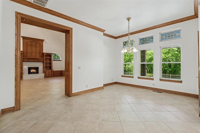 12700 Jabez Rd, Edmond, OK 73013 - unfurnished room with a chandelier, crown molding, a fireplace, and light tile patterned flooring
