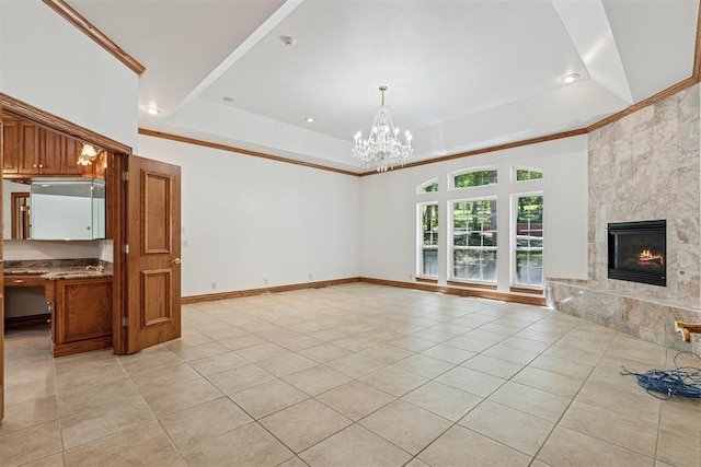 12700 Jabez Rd, Edmond, OK 73013 - unfurnished living room with light tile patterned floors, a tray ceiling, crown molding, a chandelier, and a high end fireplace