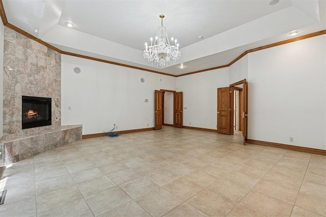 12700 Jabez Rd, Edmond, OK 73013 - unfurnished living room with ornamental molding, a raised ceiling, a chandelier, a high end fireplace, and recessed lighting