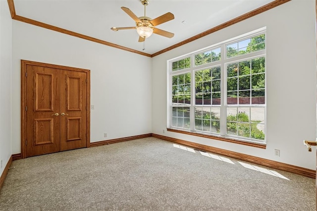 12700 Jabez Rd, Edmond, OK 73013 - carpeted empty room featuring ornamental molding and ceiling fan