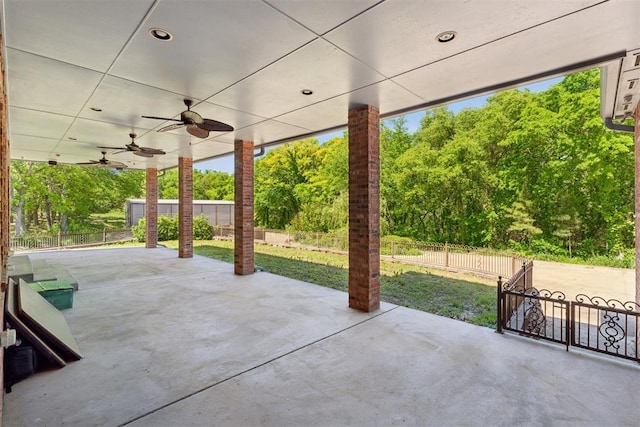 12700 Jabez Rd, Edmond, OK 73013 - fenced backyard featuring a ceiling fan and a patio