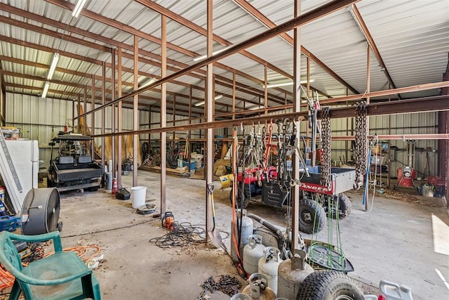 12700 Jabez Rd, Edmond, OK 73013 - garage featuring freestanding refrigerator and metal wall