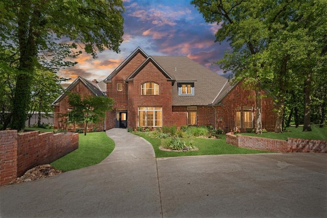 12700 Jabez Rd, Edmond, OK 73013 - traditional-style house featuring brick siding and a yard