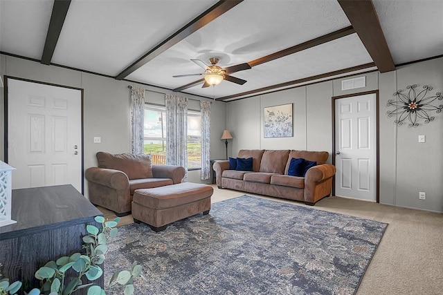 10284 N 2128, Foss, OK 73647 - carpeted living area featuring beamed ceiling, ceiling fan, and a decorative wall
