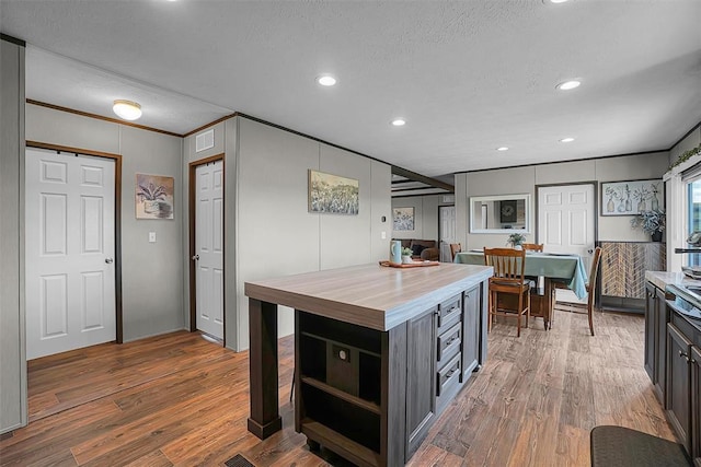 10284 N 2128, Foss, OK 73647 - kitchen featuring wooden counters, crown molding, wood finished floors, open shelves, and recessed lighting