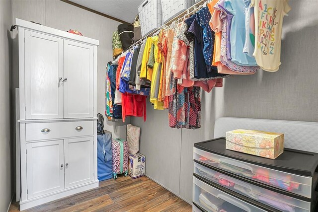 10284 N 2128, Foss, OK 73647 - walk in closet with wood finished floors