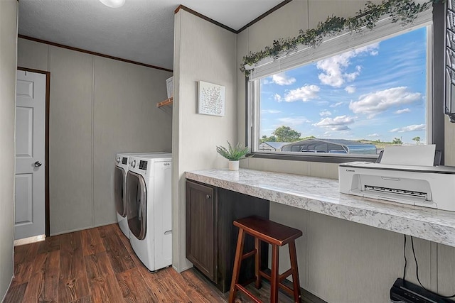 10284 N 2128, Foss, OK 73647 - clothes washing area featuring washing machine and clothes dryer, ornamental molding, and dark wood-style flooring