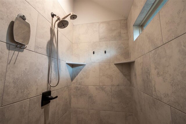 bathroom view of tiled shower