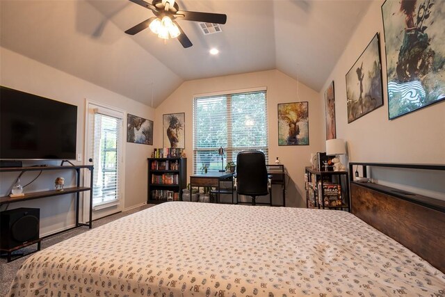 carpeted bedroom with vaulted ceiling, ceiling fan, a desk, and baseboards