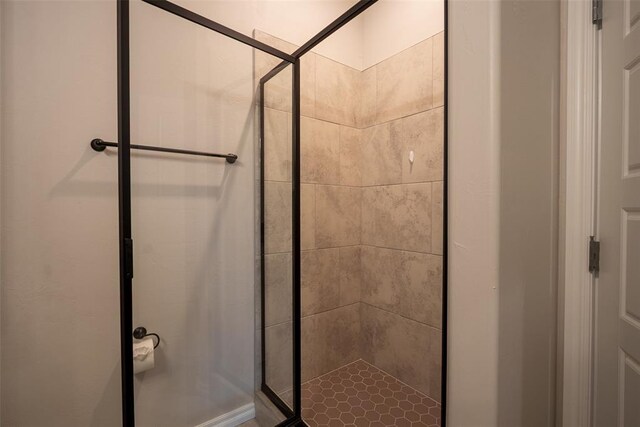 bathroom with a shower stall