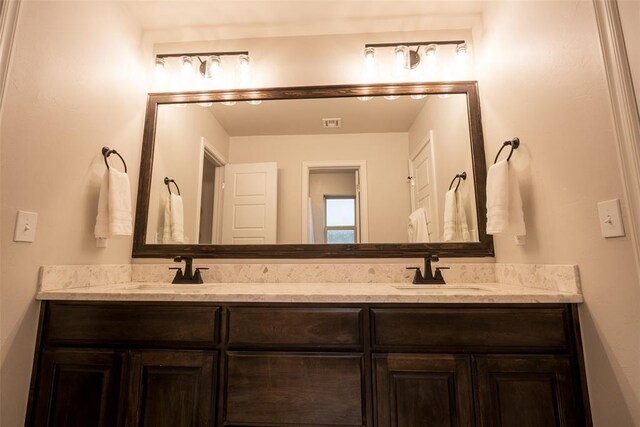 full bathroom featuring double vanity