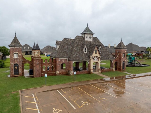 view of building exterior with uncovered parking