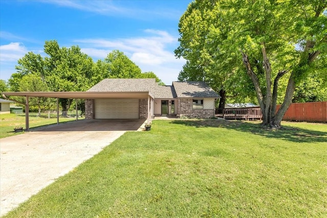 ranch-style home with fence, an attached garage, a front lawn, brick siding, and driveway