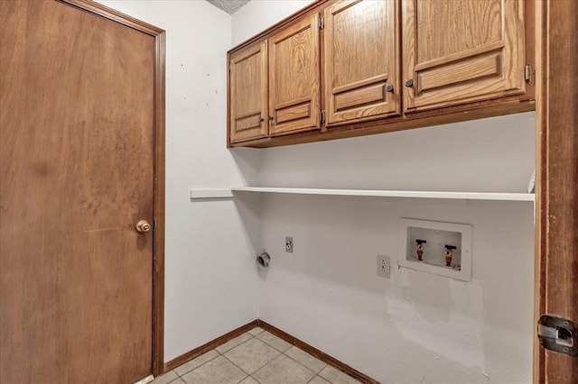laundry area with washer hookup, hookup for an electric dryer, cabinet space, light tile patterned floors, and baseboards