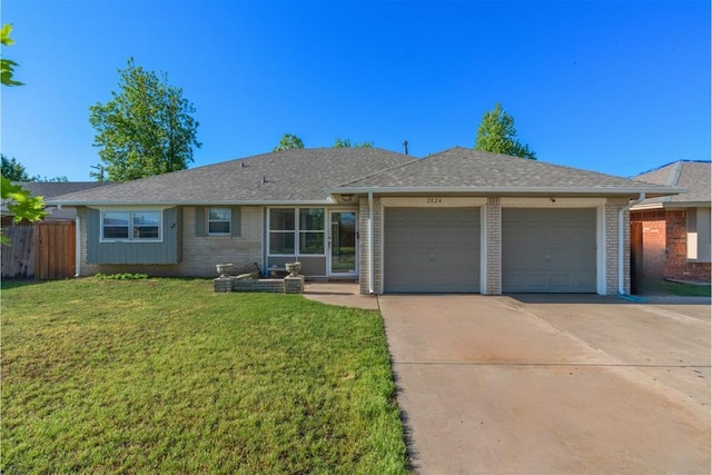 ranch-style house with a front yard, brick siding, fence, concrete driveway, and an attached garage