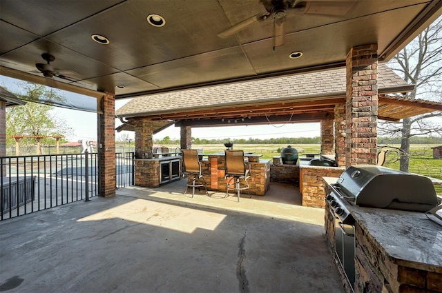 4495 SE 37th St, Norman, OK 73072 - view of patio / terrace featuring exterior kitchen and a ceiling fan