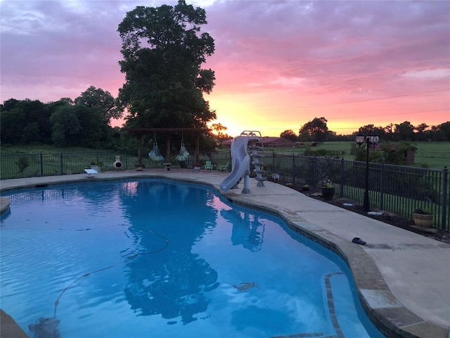 4495 SE 37th St, Norman, OK 73072 - view of pool with a water slide and a fenced backyard
