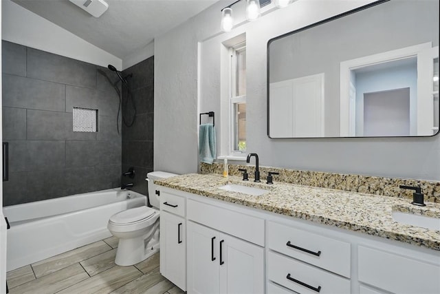 3408 Partridge Rd, Oklahoma City, OK 73120 - full bathroom featuring a sink, washtub / shower combination, vaulted ceiling, and toilet