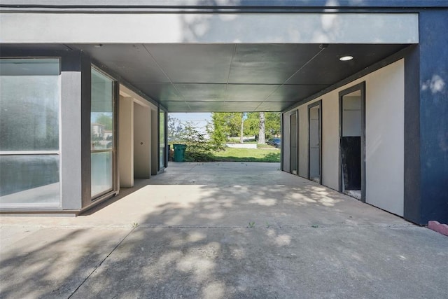 3408 Partridge Rd, Oklahoma City, OK 73120 - view of patio featuring a carport