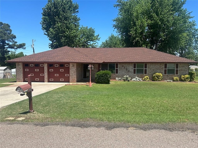 1721 E Ridgeview Ter, Mustang, OK 73064 - single story home featuring a garage, brick siding, a front lawn, concrete driveway, and a shingled roof
